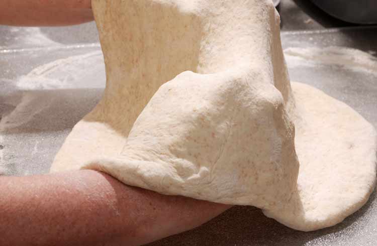Italian Pizza Dough Stretched by hands