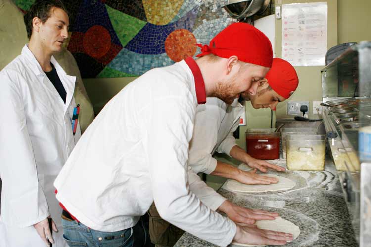 Group pizza course teaching at our pizza school Group pizza course teaching