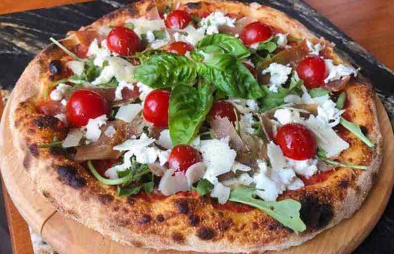 Beautiful Neapolitan pizza with cherry tomatoes